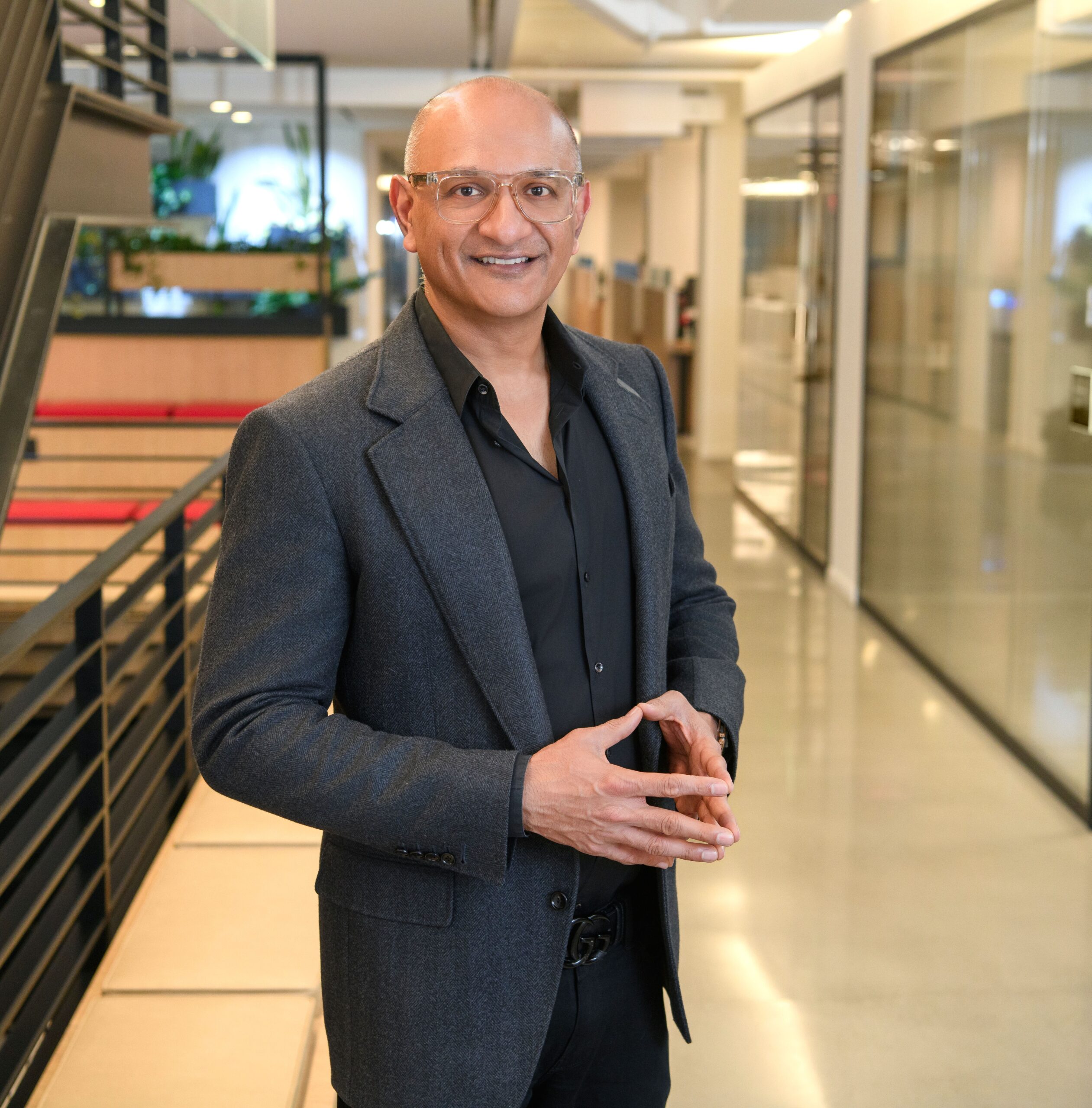 Cisco headquarters building interior of Jeetu Patel standing